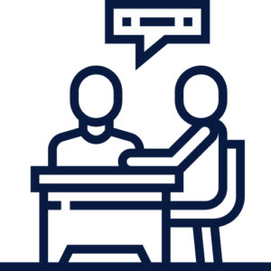 Two people having a conversation at a desk with a speech bubble.